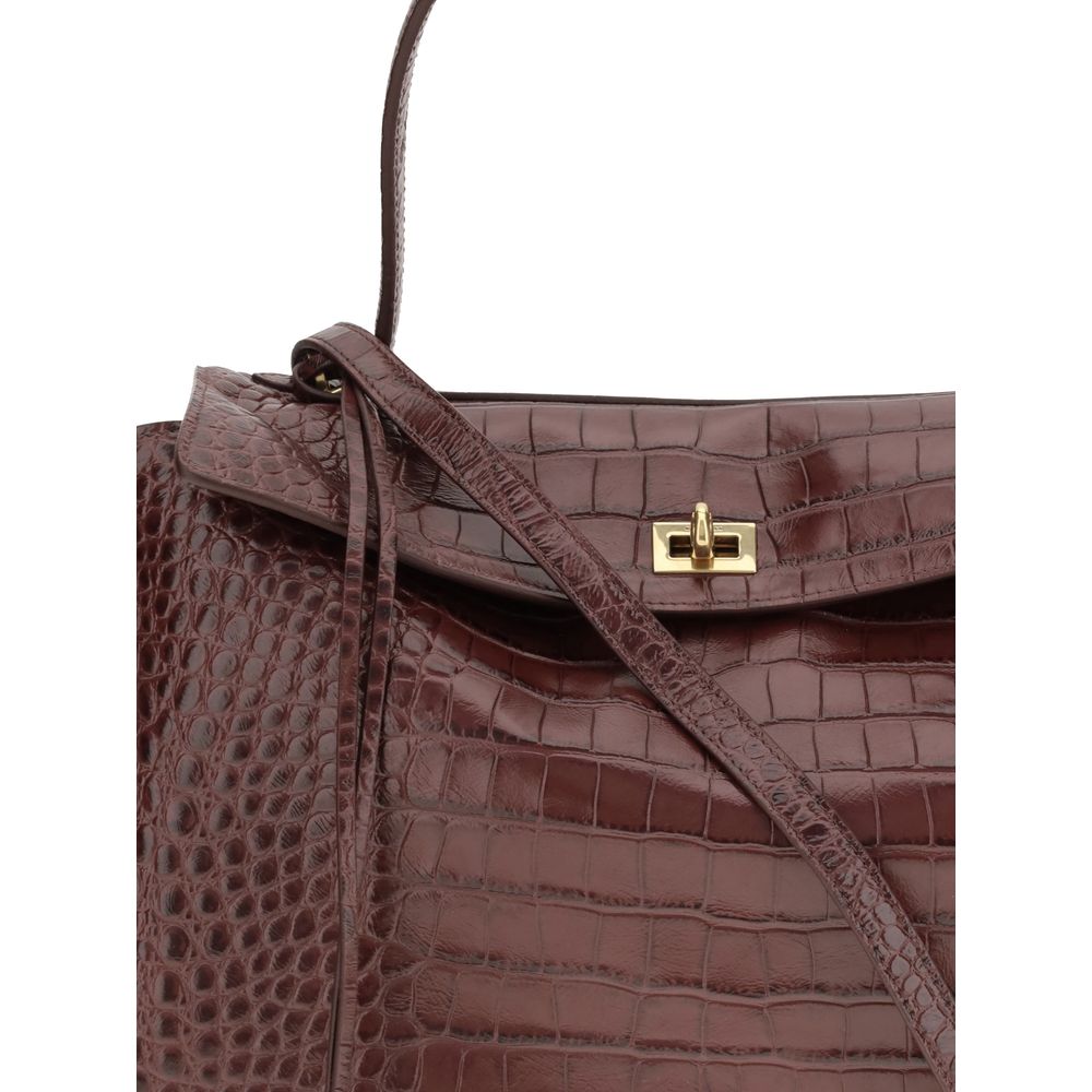 Balenciaga Brown Calf Leather Bos Taurus Handbag with crocodile-effect design and gold hardware, featuring a sophisticated flap closure.