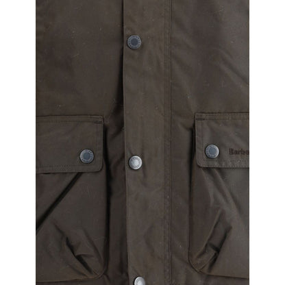Close-up of Barbour Brown Cotton Rain Coat with button flap pockets showcasing waterproof material and classic design.