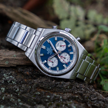 CASIO EDIFICE Mod. MOTORSPORT CHRONOGRAPH BLUE wristwatch with stainless steel strap and sapphire dial, placed on natural background.