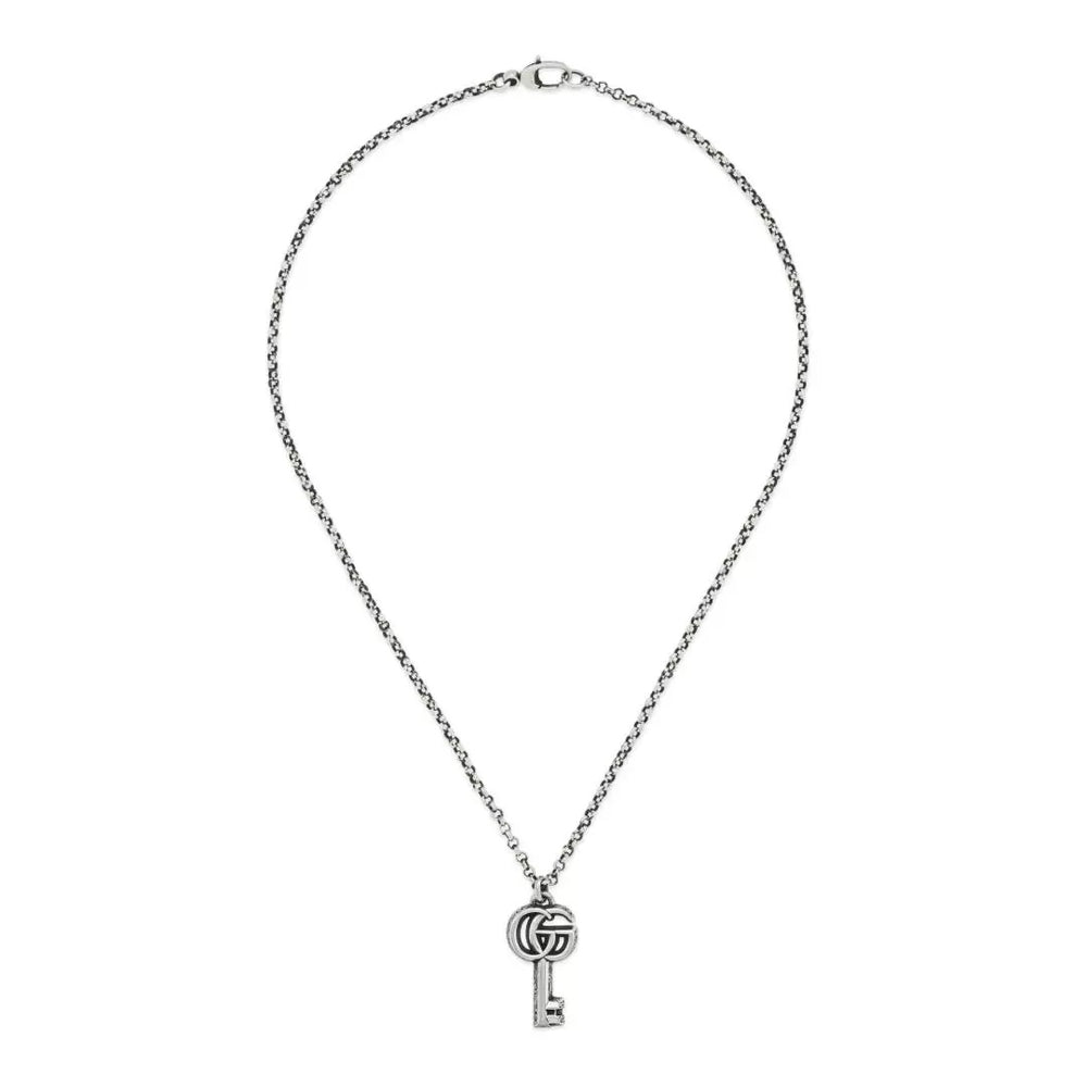 Elegant key pendant necklace from Gucci collection, featuring the iconic COLLANE GUCCI MOD. YBB627757001 design on a silver chain.