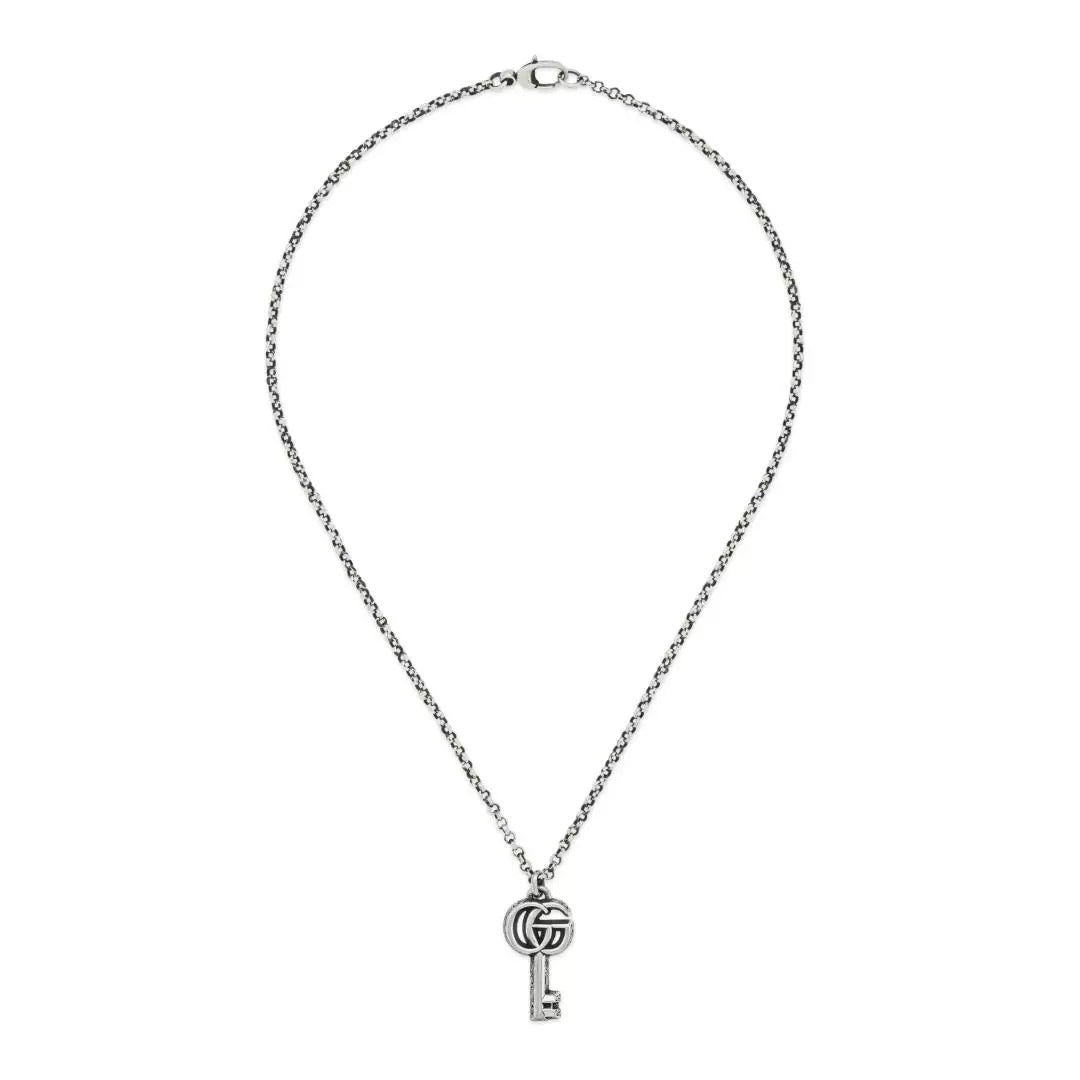 Elegant key pendant necklace from Gucci collection, featuring the iconic COLLANE GUCCI MOD. YBB627757001 design on a silver chain.