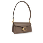 Coach Tabby 20 shoulder bag with multifunctional pockets, snap closure, leather design, and removable strap.