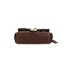 Bottom view of Coach Tabby 26 Shoulder Bag in chestnut brown quilted leather with C logo plaque, featuring foldover top and magnetic fastening.