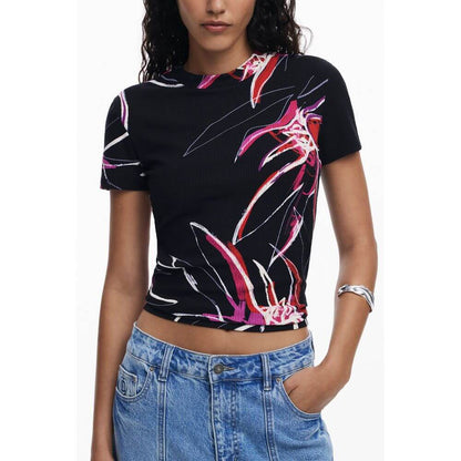 Woman wearing Desigual Black Viscose Women Top with bold print design, crew neck, and short sleeves, showcasing signature style.