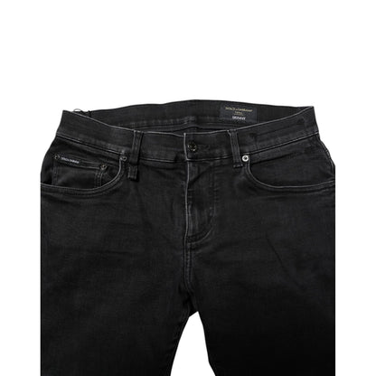 Dolce & Gabbana Black Cotton Skinny Men Denim Jeans with zipper and button closure, featuring logo details. Made in Italy.