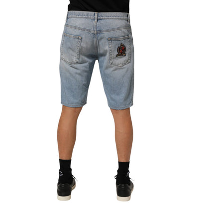 Back view of Dolce & Gabbana Blue Cotton Distressed Denim Bermuda Shorts showing pocket embroidery.
