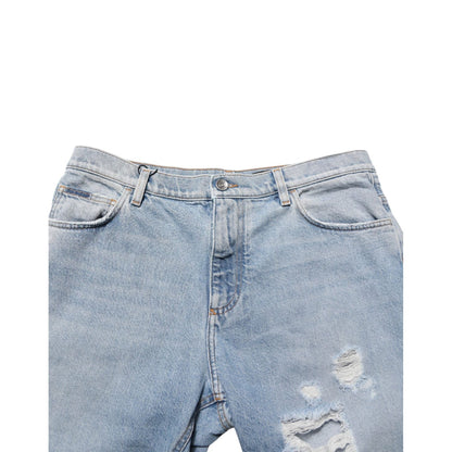Dolce & Gabbana Blue Cotton Distressed Denim Bermuda Shorts with five-pocket styling and rugged detailing for casual outfits.