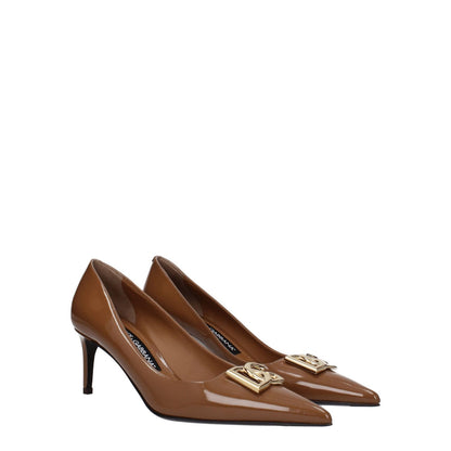 Dolce & Gabbana Brown Leather High Heel Pumps with logo detail, pointy toe and 6 cm mid heel, caramel accent, stylish leather design.