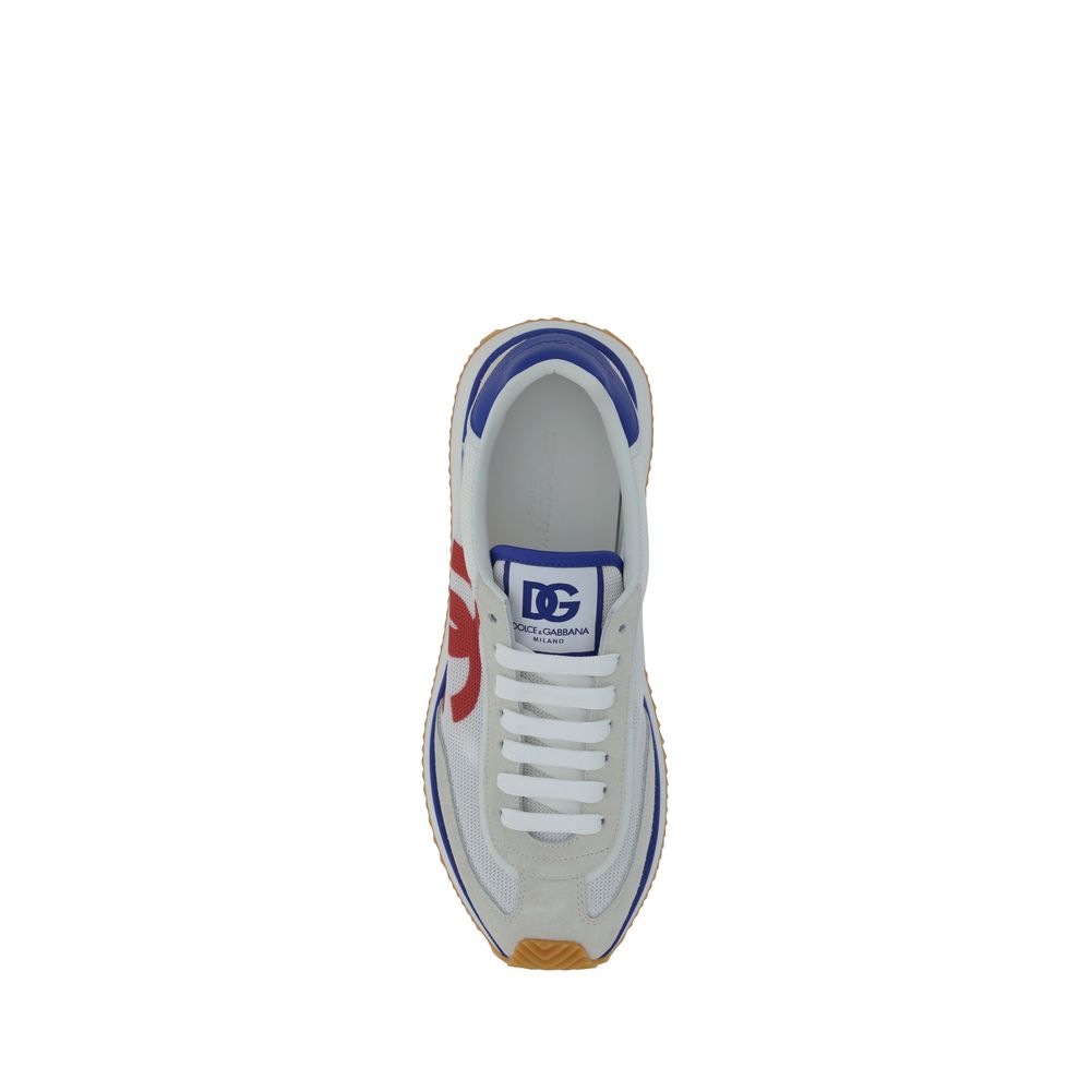 Top view of Dolce & Gabbana Multicolor Rubber Low Top Sneakers featuring a lace-up front and printed logo on the tongue.