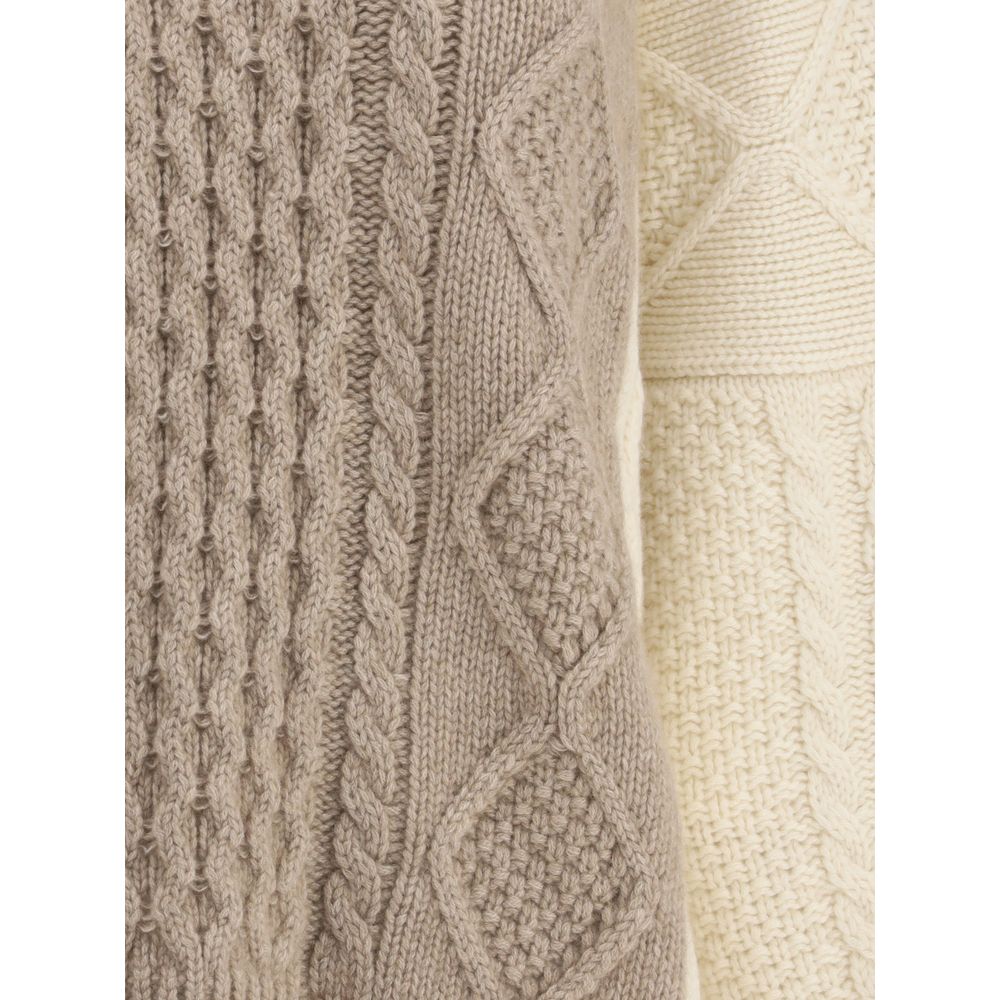 Close-up of Ella Cream Cashmere Cashmere Sweater showcasing its two-tone cable-knit design and soft texture for winter fashion.