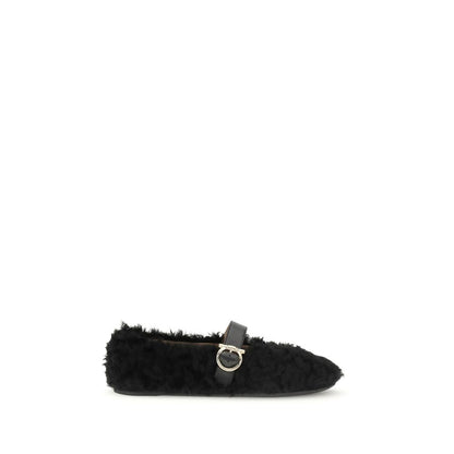 Ferragamo Black Fur Ballet Flats with Gancini buckle and shearling lining, perfect for AW25. Features a flexible rubber sole and contoured neckline.
