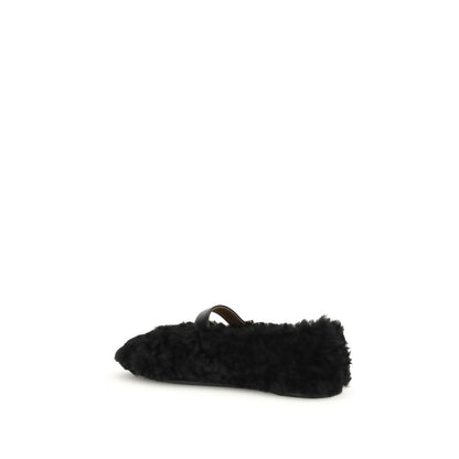 Ferragamo Black Fur Ballet Flats with Gancini buckle and shearling lining.