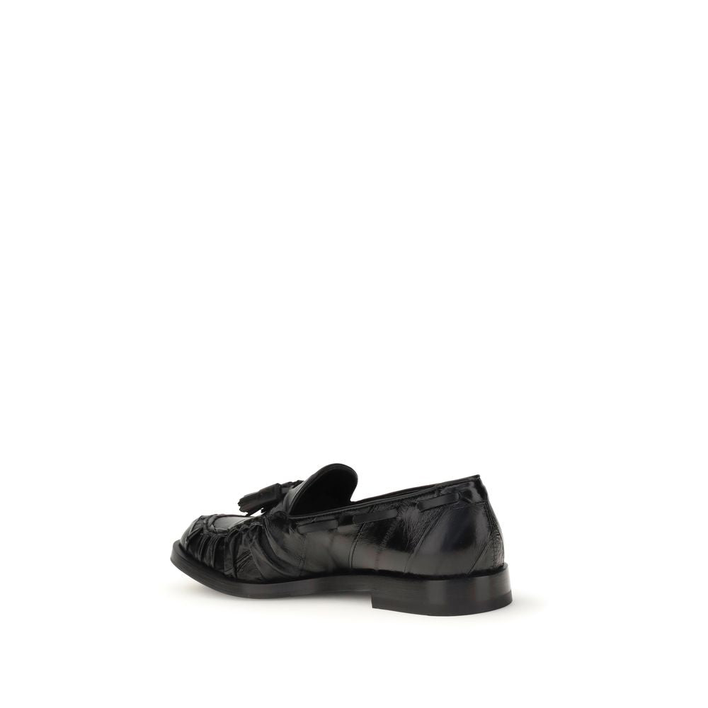 Fratelli Rossetti Black Rubber Slip-On Loafers with tasseled design, round toe, flat sole, made with 100% leather upper.