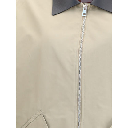 Close-up of Givenchy Beige Cotton Jackets And Coat with zipper and leather collar detail.