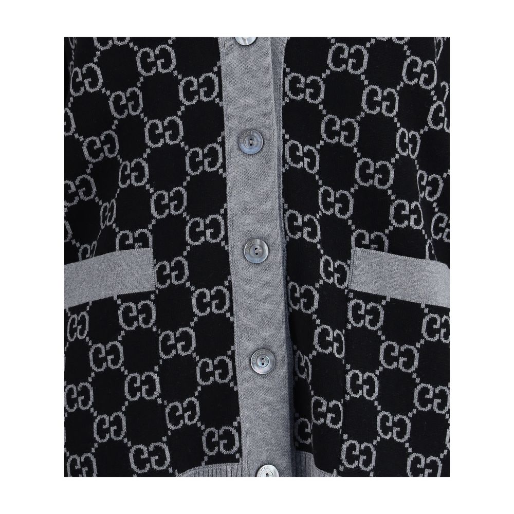 Close-up of Gucci Black Wool Cardigan with GG Supreme pattern, V-neck and buttons, showcasing the versatile design and ribbed trim.