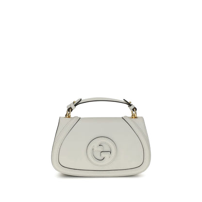Gucci White Calf Leather Bos Taurus Handbag with tonal GG applique and removable strap, featuring a hidden magnetic closure and back slit pocket.