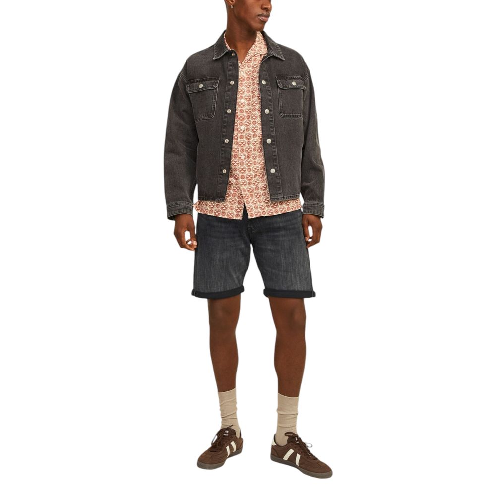 Man wearing Jack Jones Black Cotton Bermuda Shorts with a casual jacket and shirt, showcasing a stylish and comfortable summer outfit.