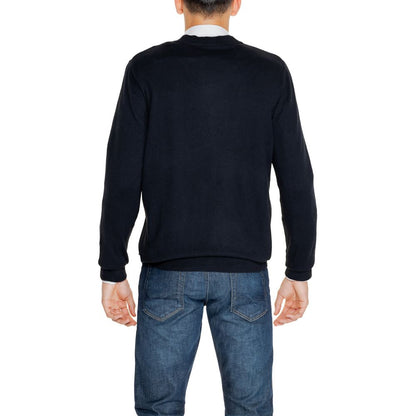 Back view of a man wearing Jack Jones Black Cotton Cardigan, paired with jeans, showcasing the soft knit and stylish design.