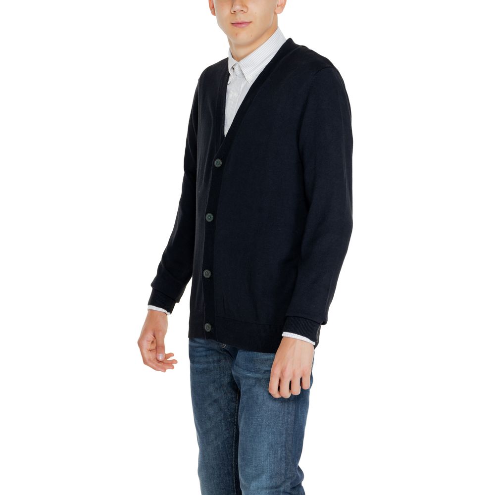 Model wearing Jack Jones Black Cotton Cardigan, featuring a V-neckline and button-down front, perfect for casual or smart outfits.