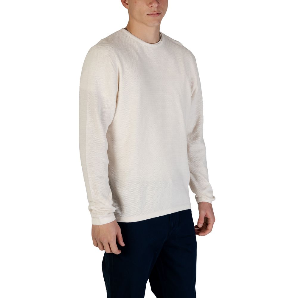 Man wearing Jack Jones White Cotton Sweatshirt with a classic crew neck and comfortable regular fit, showcasing its versatile design.