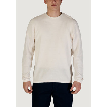 Man wearing Jack Jones White Cotton Sweatshirt with classic crew neck, showcasing sustainable, versatile fashion in fine knit texture.
