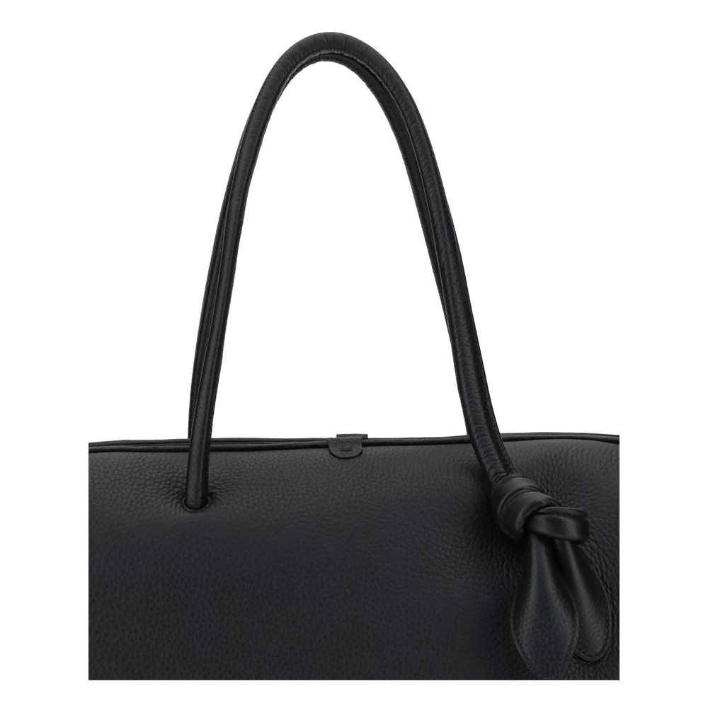 Close-up of Jacquemus Black Calf Leather Bos Taurus Handbag with bow detail and grained texture.