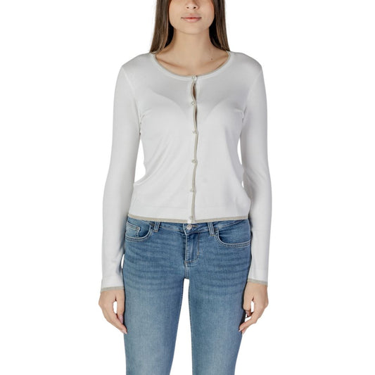 Woman wearing Liu Jo White Viscose Cardigan with jeans, front view, long-sleeved with button closure, essential wardrobe piece.