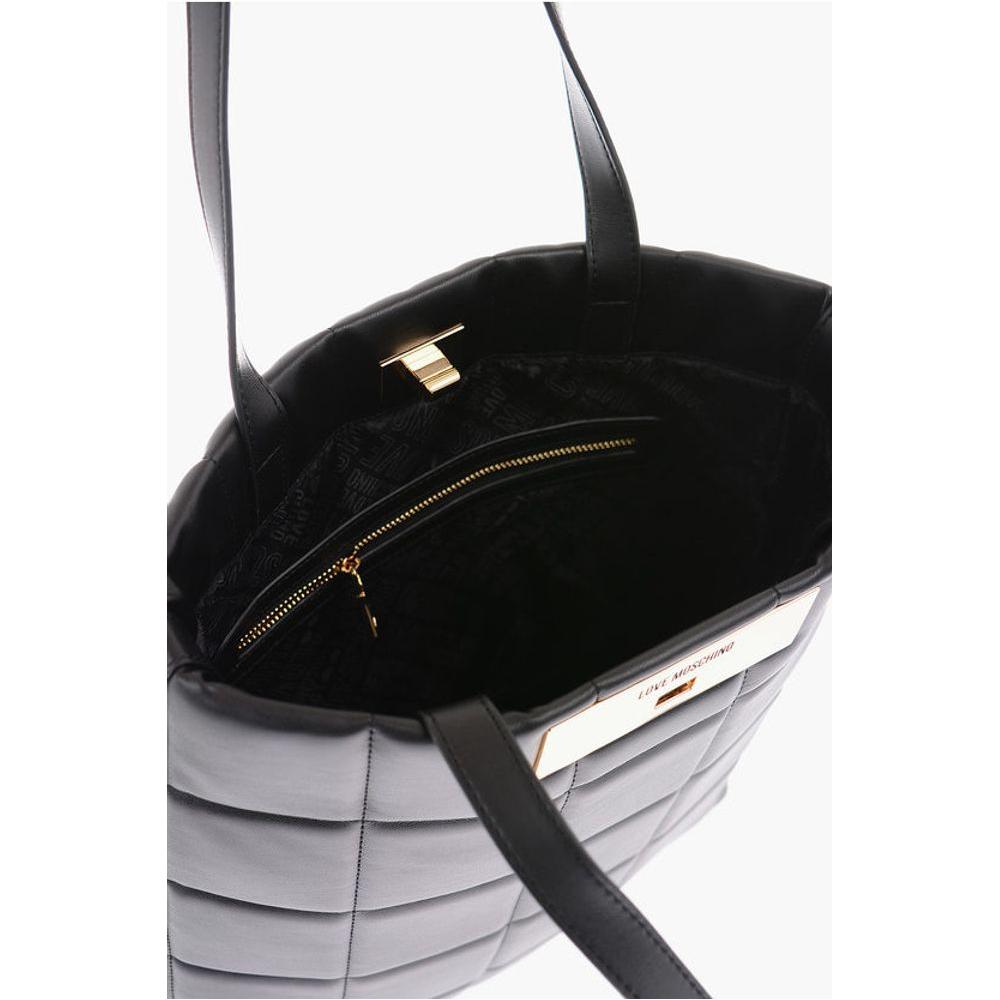 Front view with bag zipped and handles upright.