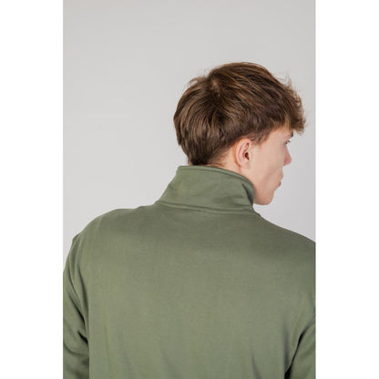 Back view of New Balance Green Cotton Sweatshirt with high collar worn by a model, showcasing its soft cotton material and modern design.