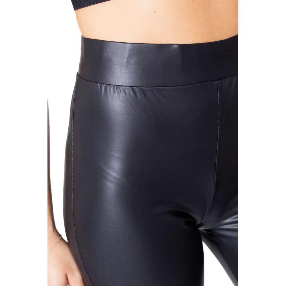 Close-up of Only Black Polyester Leggings with glossy finish and stretch fit.