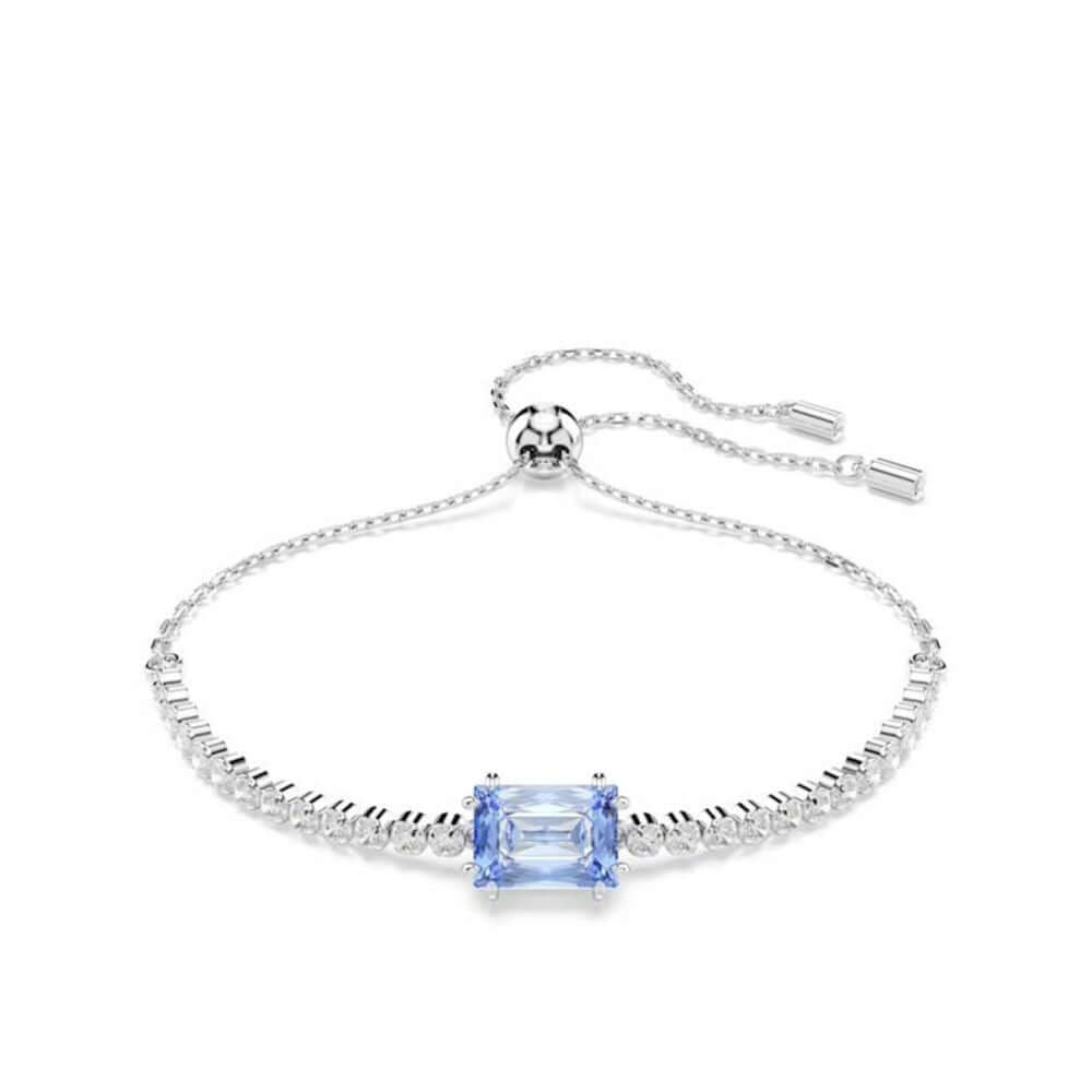 Elegant silver bracelet with blue gemstone centerpiece, SWAROVSKI brand design, adjustable chain clasp, sparkling accents.