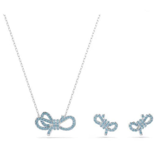 SWAROVSKI Mod. 5723554 Lifelong Bow Set with blue crystals and rhodium plating featuring necklace and earrings in bow design.