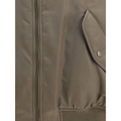 Close-up of Saint Laurent Bicolor Polyamide Bomber with water-repellent fabric and snap pocket detail.