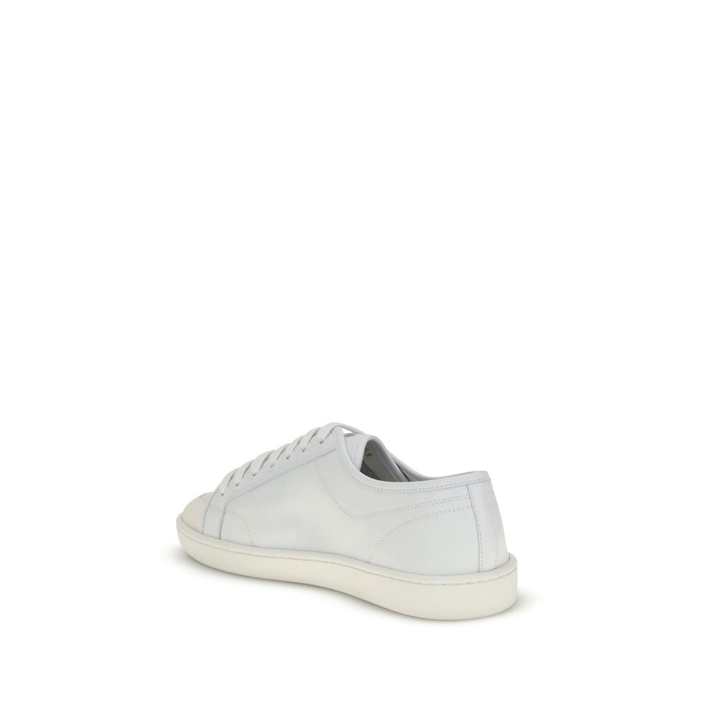 Saint Laurent White Calf Leather Bos Taurus Low Top Sneakers with lace-up design and gold signature, viewed from the back.