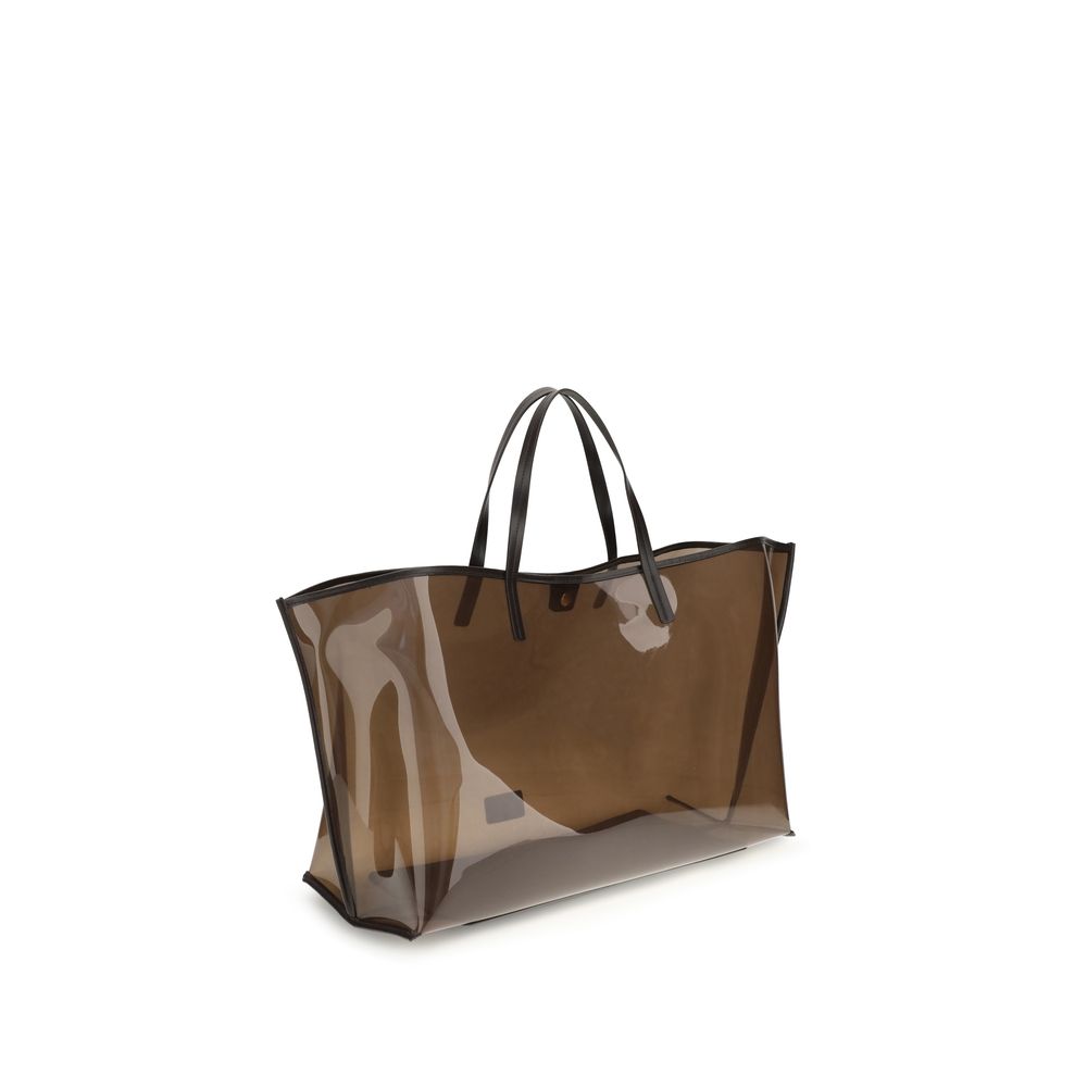 Staud Brown Pvc Handbag showcasing a large, transparent tote design with black handles, featuring contemporary style and practicality.