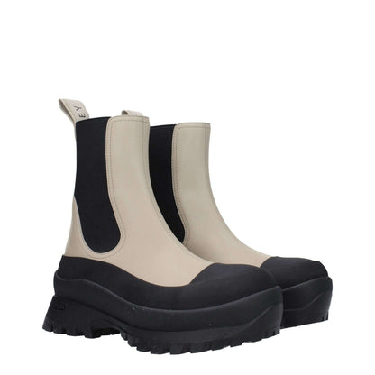 Stella McCartney Black Leather Ankle Boots with taupe accents, eco-friendly rubber sole, and back logo detail. Casual style.