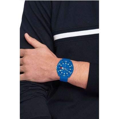 Unisex TOMMY HILFIGER Mod. 1792068 watch with blue silicone strap and multifunction dial displayed on a wrist, quartz movement.