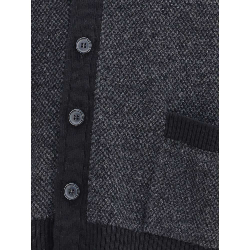 Close-up of Thom Browne Black Fleece Wool Cardigan with buttons and textured fabric.