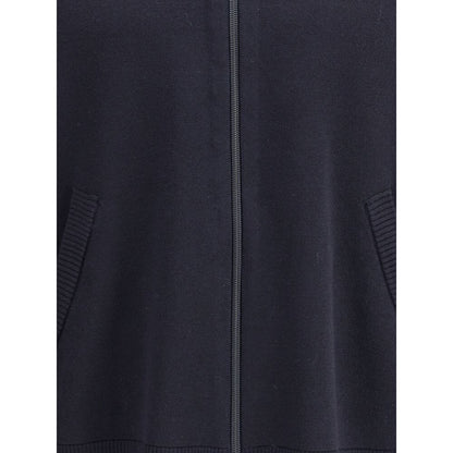 Close-up of Thom Browne Blue Fleece Wool Cardigan featuring the front zipper and side welt pockets, showcasing ribbed details.