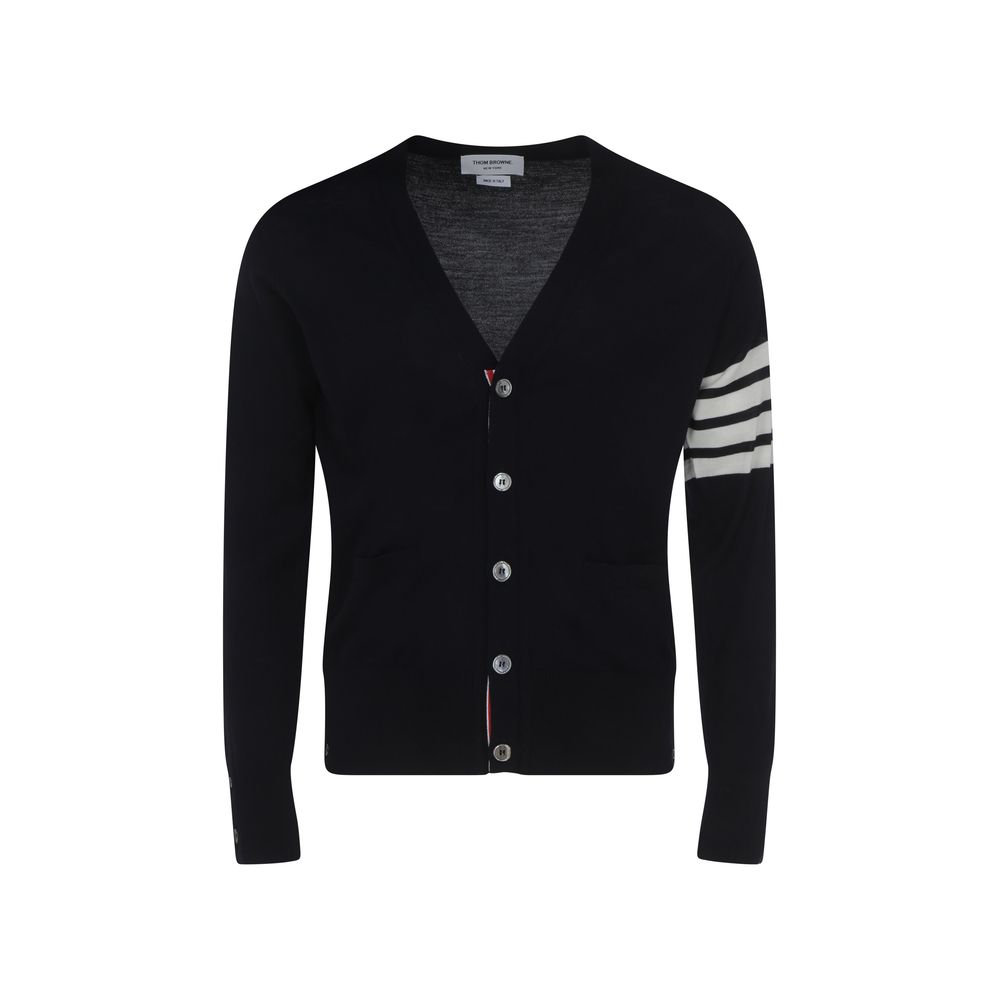 Thom Browne Cardigan with striped cuffs, button closure, V-neck, and brand logo on sleeve, made of 100% fleece wool.