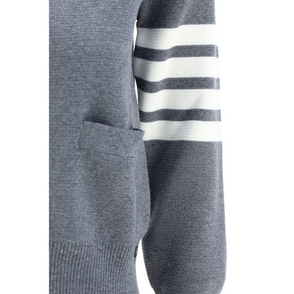 Close-up of Thom Browne Gray Fleece Wool Cardigan featuring contrasting stripes on arm, open pocket, and ribbed cuffs.