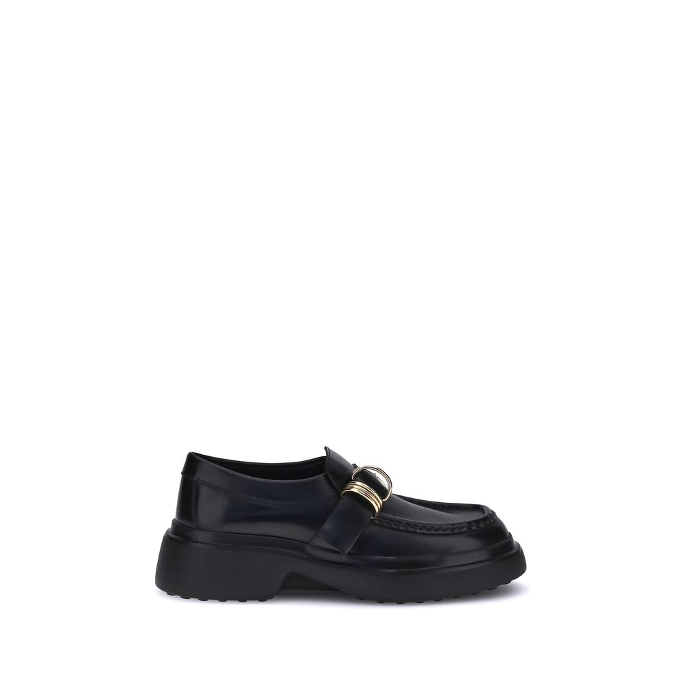Tod's Black Rubber Platform Loafers with metal ring embellishments on black nappa leather, featuring a modern platform sole.