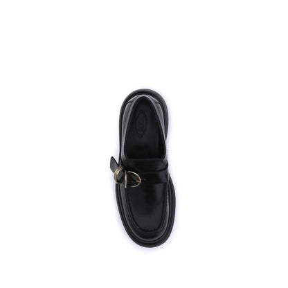 Top view of Tod's Black Rubber Platform Loafers with nappa leather and metal rings embellishment, showcasing timeless elegance and style.