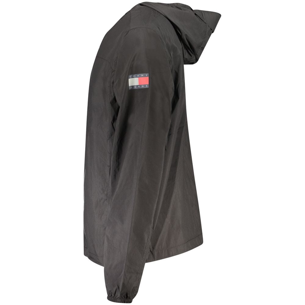 Tommy Hilfiger Black Polyamide Men Jacket with hood, logo on sleeve, highlighting eco-friendly fashion.