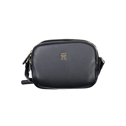 Tommy Hilfiger Blue Polyester Handbag with adjustable strap, zip closure, and gold logo detail; features two compartments and internal pocket.