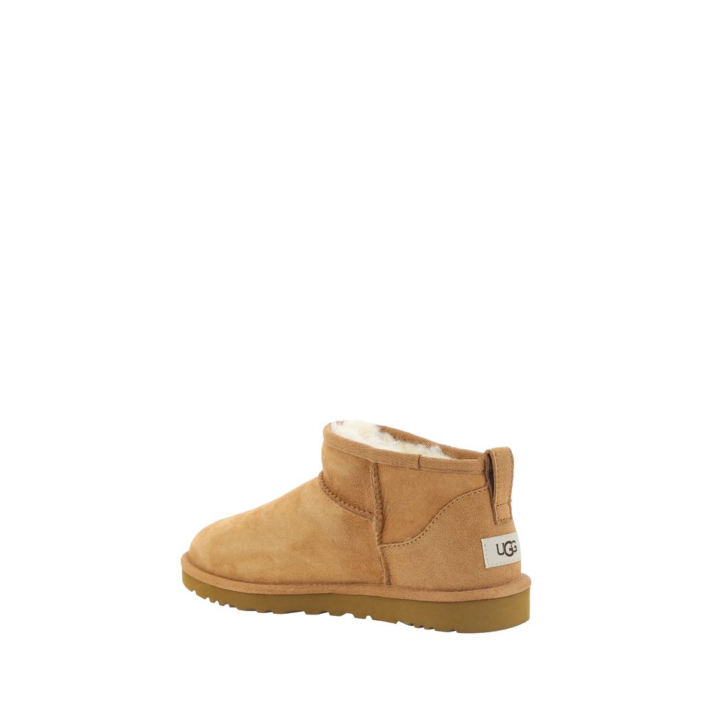UGG Brown Goatskin Ankle Boots with shearling lining, knurled sole, round toe, and suede design showcasing iconic monogram on heel.