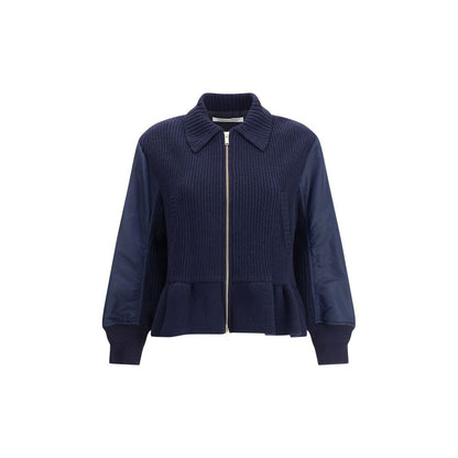 Undercover Blue Wool Bomber with classic collar, ribbed cuffs, flared hem, and wool inserts showcasing modern streetwear style.