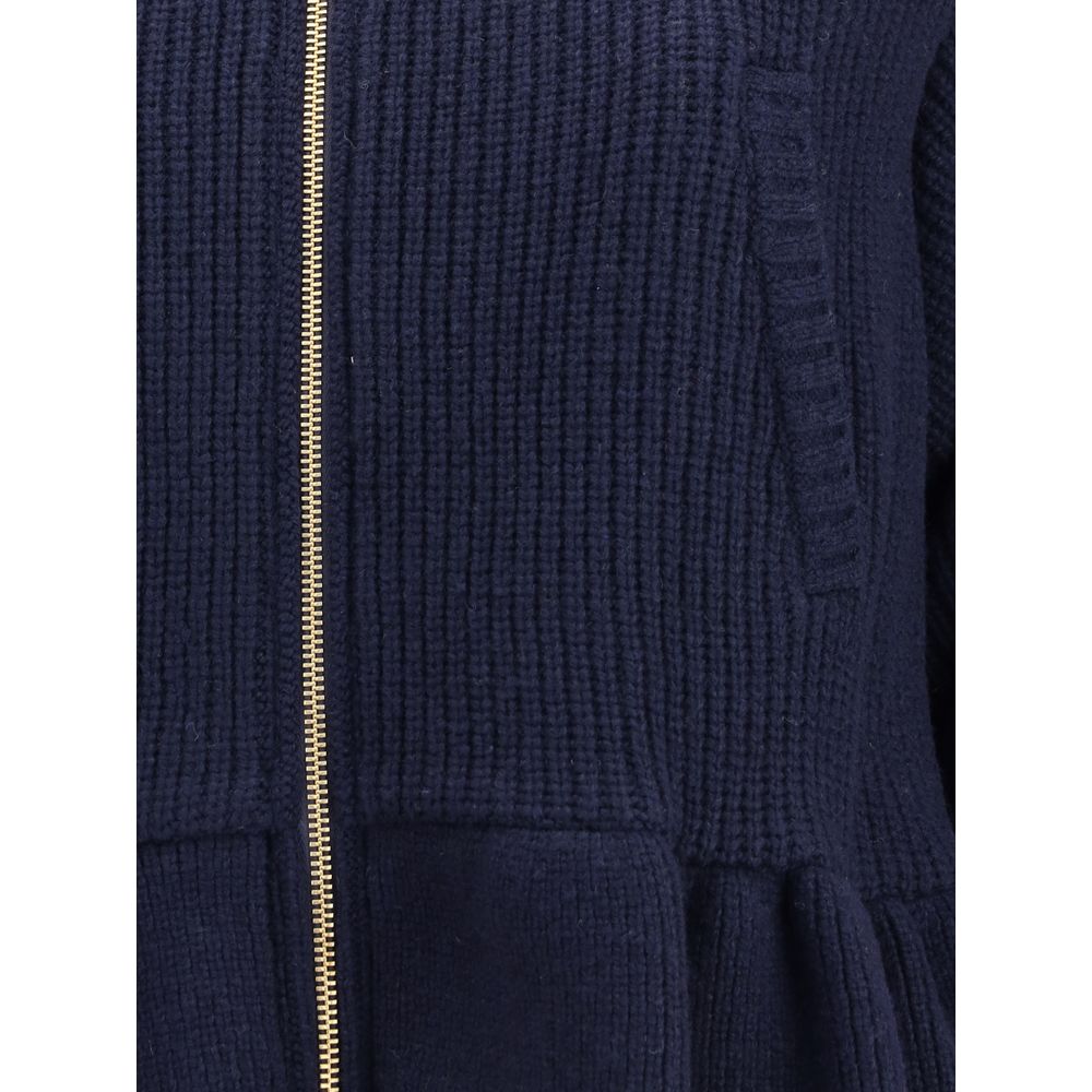 Close-up of Undercover Blue Wool Bomber showing zipper and wool texture, featuring sophisticated streetwear style and functionality.