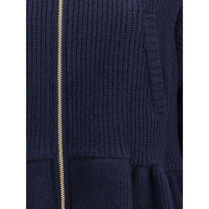 Close-up of Undercover Blue Wool Bomber showing zipper and wool texture, featuring sophisticated streetwear style and functionality.