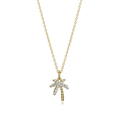 Gold palm tree pendant necklace on a delicate chain with sparkling accents.
